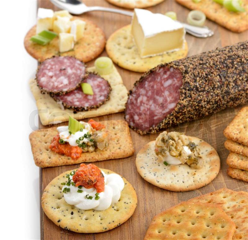 Cracker mit Salami , Käse und Dips | Stockfoto | Colourbox